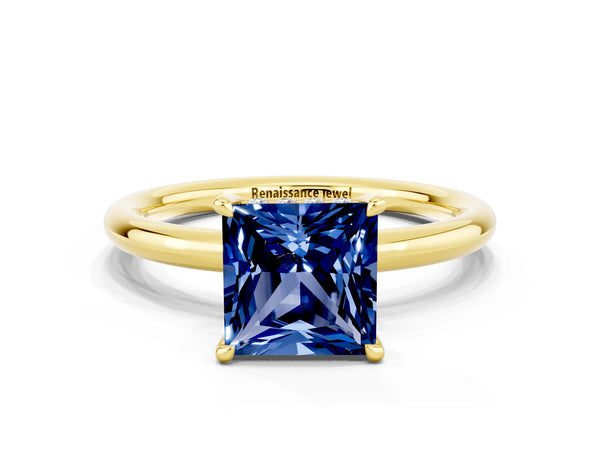 Yellow gold Princess Cut Blue Sapphire Solitaire Ring with Thin Band and Four-Prong Setting