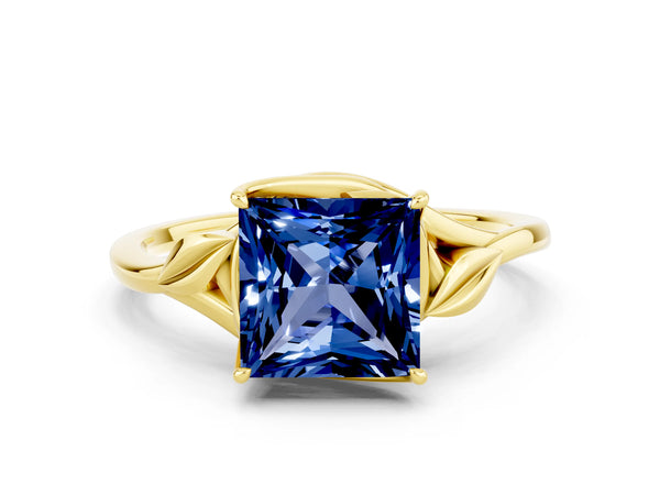 Yellow gold Princess Cut Blue Sapphire Solitaire Ring with Twist Band and Four-Prong Setting