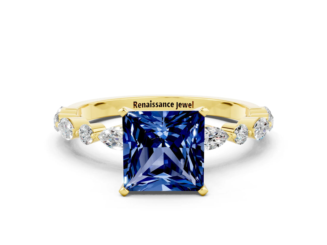 Yellow gold Princess Cut Blue Sapphire Solitaire with Side Stones on a Pavé Band and Four-Prong Setting