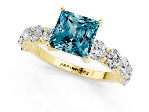 Yellow gold Princess Cut Blue Topaz Prong Setting with Side Stones on a Pave Band_1