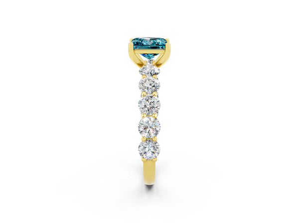 Yellow gold Princess Cut Blue Topaz Prong Setting with Side Stones on a Pave Band