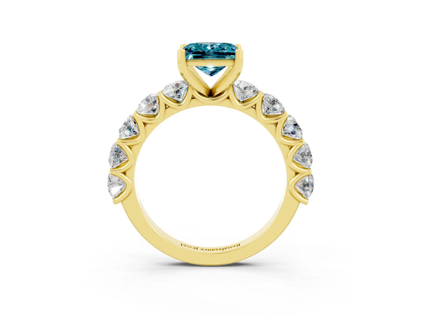 Yellow gold Princess Cut Blue Topaz Prong Setting with Side Stones on a Pave Band