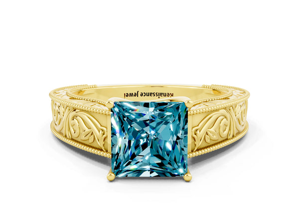 Yellow gold Princess Cut Blue Topaz Solitaire Ring with Engraved Band and Four-Prong Setting