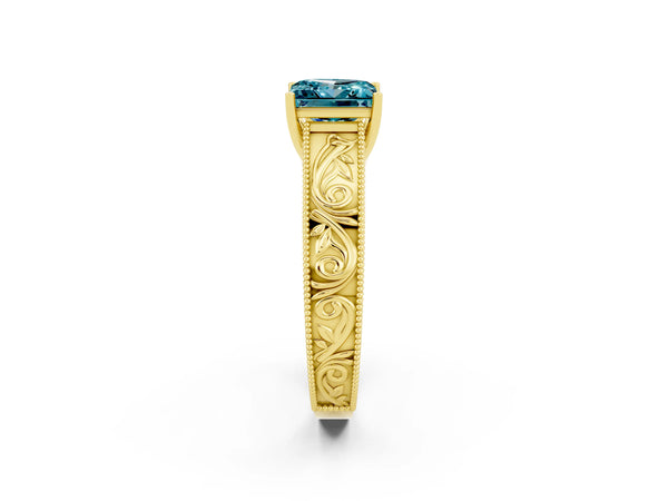 Yellow gold Princess Cut Blue Topaz Solitaire Ring with Engraved Band and Four-Prong Setting