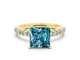 Yellow gold Princess Cut Blue Topaz Solitaire Ring with Pavé Accents and Four-Prong Setting