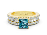 Yellow gold Princess Cut Blue Topaz Solitaire Ring with Pavé and Channel Set Band