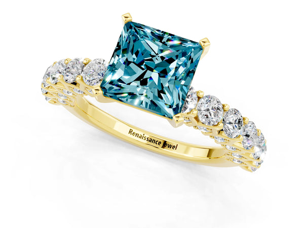 Yellow gold Princess Cut Blue Topaz Solitaire Ring with Shared Prong Pavé Band and Four-Prong Setting