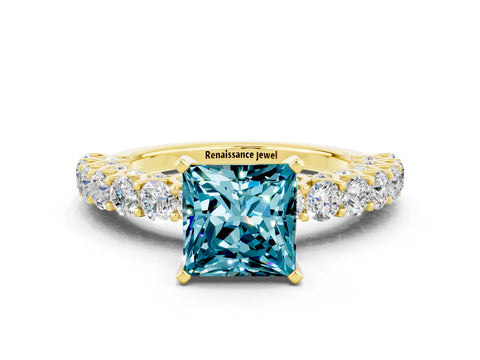 Yellow gold Princess Cut Blue Topaz Solitaire Ring with Shared Prong Pavé Band and Four-Prong Setting