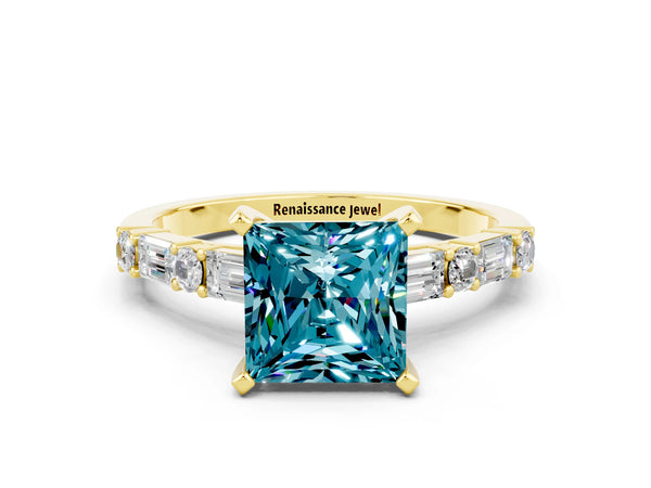 Yellow gold Princess Cut Blue Topaz Solitaire with Side Baguettes and Channel Set Band