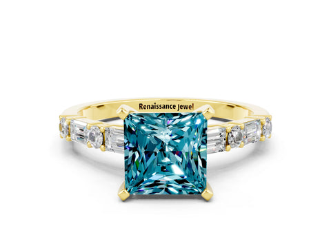 Yellow gold Princess Cut Blue Topaz Solitaire with Side Baguettes and Channel Set Band