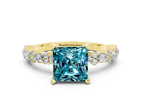 Yellow gold Princess Cut Blue Topaz Side Stone Solitaire Ring with Round  and Four-Prong Setting