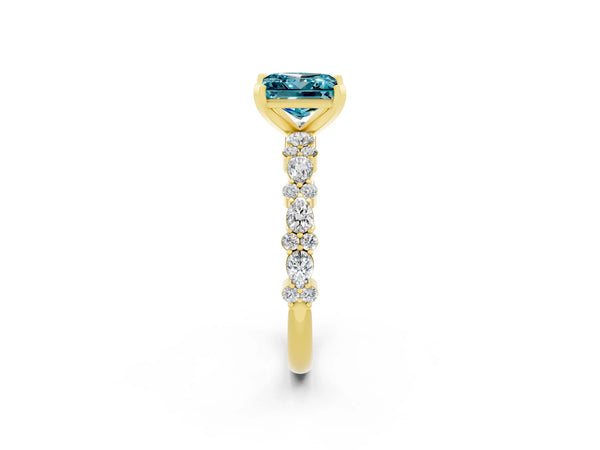 Yellow gold Princess Cut Blue Topaz Side Stone Solitaire Ring with Round  and Four-Prong Setting