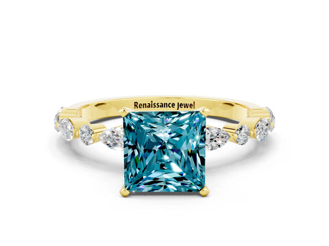 Yellow gold Princess Cut Blue Topaz Solitaire with Side Stones on a Pavé Band and Four-Prong Setting