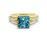 Yellow gold Princess Cut Blue Topaz Split Shank Engagement Ring with Pavé Band