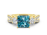 Yellow gold Princess Cut Blue Topaz Three-Stone Ring with Pavé Split Shank and Four-Prong Setting