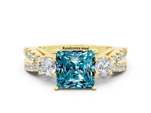 Yellow gold Princess Cut Blue Topaz Three-Stone Ring with Pavé Split Shank and Four-Prong Setting