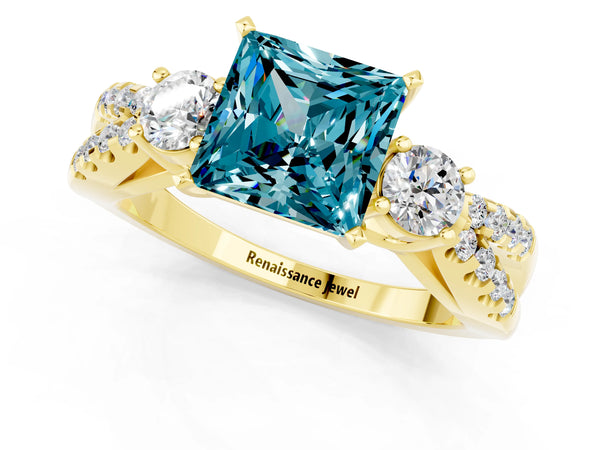 Yellow gold Princess Cut Blue Topaz Three-Stone Ring with Pavé Split Shank and Four-Prong Setting