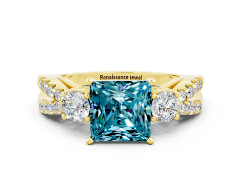 Yellow gold Princess Cut Blue Topaz Three-Stone Ring with Pavé Split Shank and Four-Prong Setting