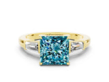 Yellow gold Princess Cut Cut Diamond Ring with Tapered Baguette Side Stones in Four-Prong Setting