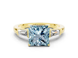 Yellow gold Princess Cut Cut Diamond Ring with Tapered Baguette Side Stones in Four-Prong Setting