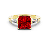 Yellow gold Princess Cut Cut Diamond Ring with Tapered Baguette Side Stones in Four-Prong Setting