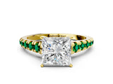 Yellow gold Princess Cut Diamond Cathedral Solitaire Ring with Round with Emerald side stone Pavé Band