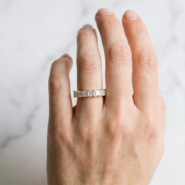 Yellow gold Princess Cut Diamond Eternity Band with Channel Setting and Shared Prong