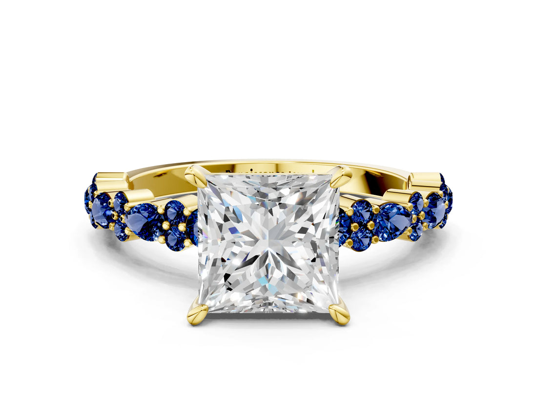 Yellow gold Princess Cut Diamond Side Stone Solitaire Ring with Round with Blue Sapphire side stone and Four-Prong Setting