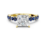 Yellow gold Princess Cut Diamond Side Stone Solitaire Ring with Round with Blue Sapphire side stone and Four-Prong Setting