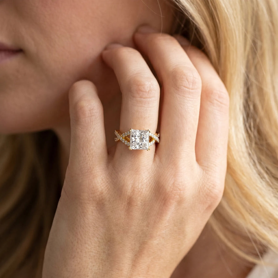 Yellow gold Princess Cut Diamond Solitaire Ring with Four-Prong Setting and Twisted Pavé Band