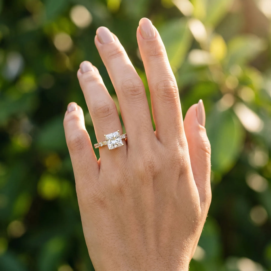 Yellow gold Princess Cut Diamond Solitaire with Side Baguettes and Channel Set Band