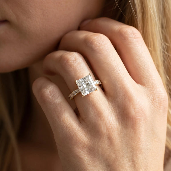 Yellow gold Princess Cut Diamond Solitaire with Side Baguettes and Channel Set Band