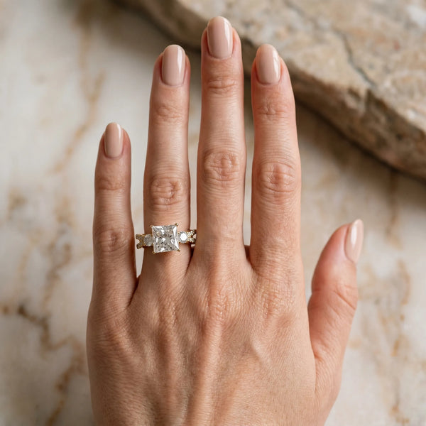 Yellow gold Princess Cut Diamond Three-Stone Ring with Pavé Split Shank and Four-Prong Setting