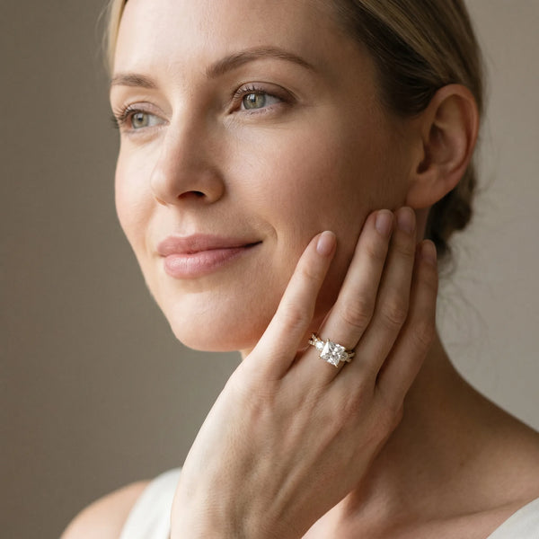 Yellow gold Princess Cut Diamond Three-Stone Ring with Pavé Split Shank and Four-Prong Setting