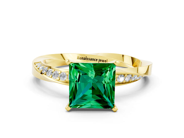 Yellow gold Princess Cut Emerald Engagement Ring with Side Stone Accents and Four-Prong Setting
