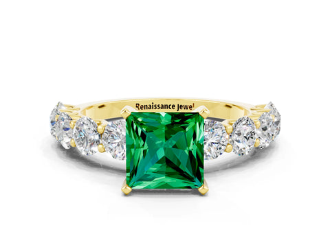 Yellow gold Princess Cut Emerald Prong Setting with Side Stones on a Pave Band