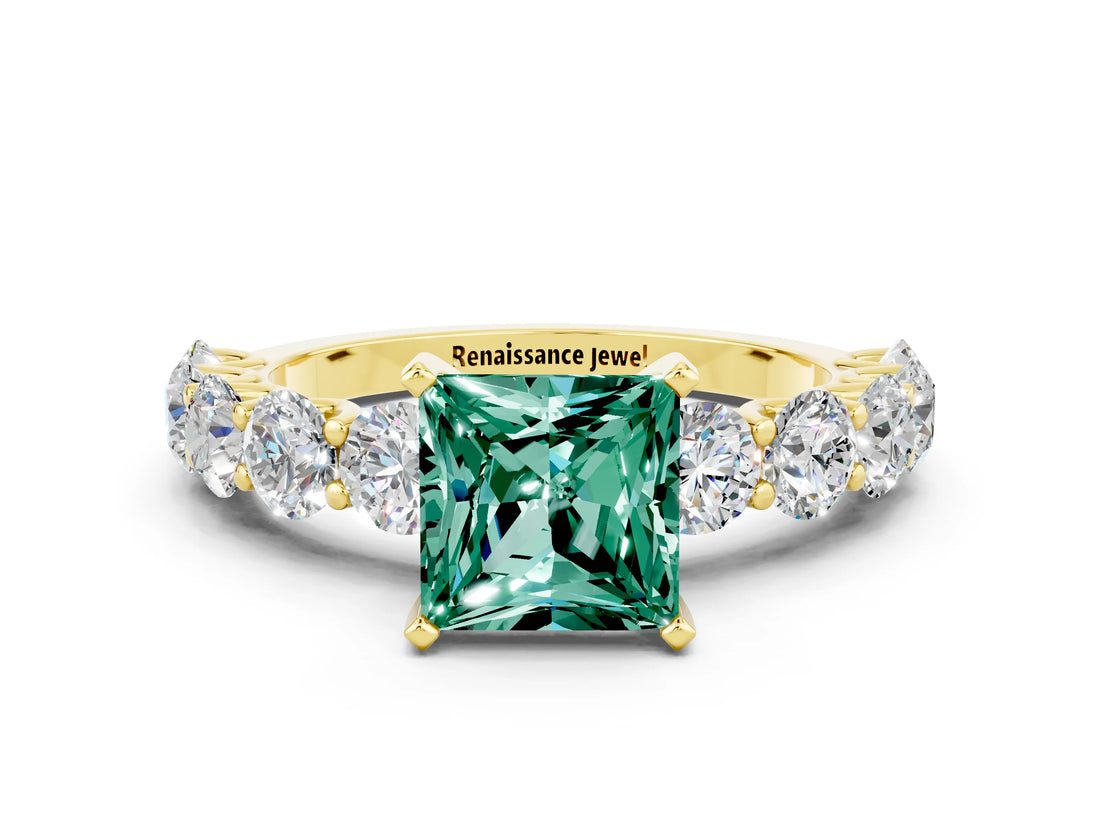 Yellow gold Princess Cut Green Sapphire Prong Setting with Side Stones on a Pave Band