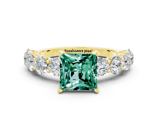 Yellow gold Princess Cut Green Sapphire Prong Setting with Side Stones on a Pave Band