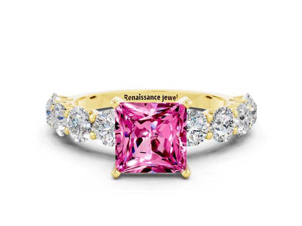 Yellow gold Princess Cut Pink Sapphire Prong Setting with Side Stones on a Pave Band