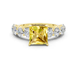 Yellow gold Princess Cut Yellow Sapphire Prong Setting with Side Stones on a Pave Band_24