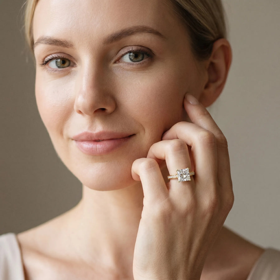Yellow gold Princess Diamond Solitaire with Pave Band and Six-Prong Setting