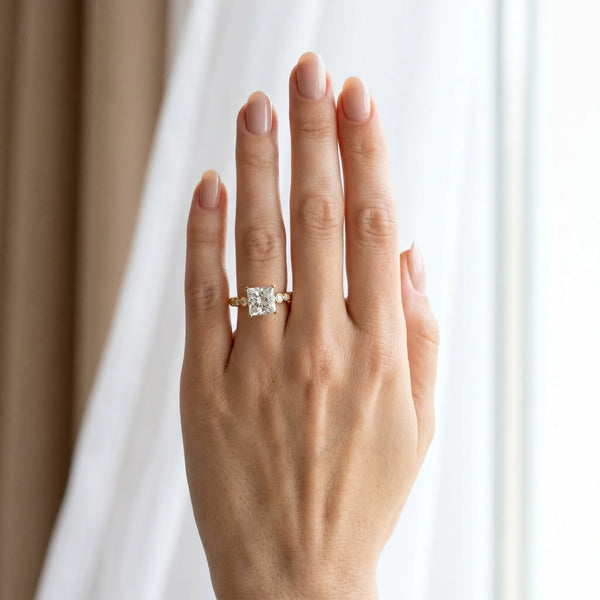 Yellow gold Princess Solitaire Bezel Accent Diamond Engagement Ring with Beaded Band and Four-Prong Setting