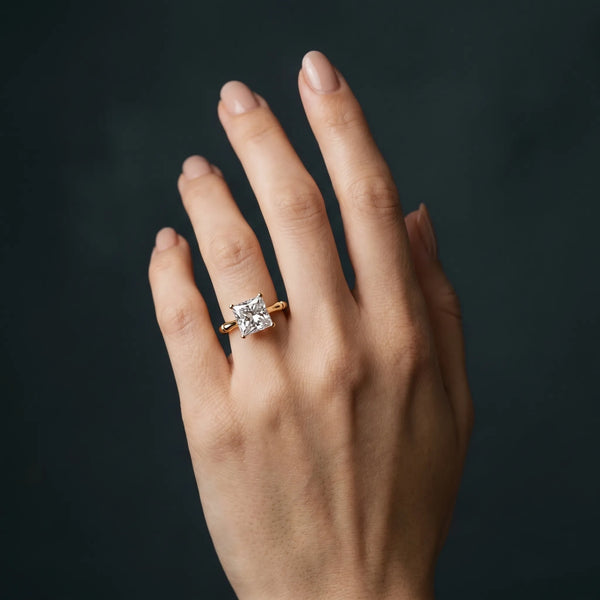 Yellow gold Princess Solitaire Diamond Ring with Bamboo Band and Four-Prong Setting