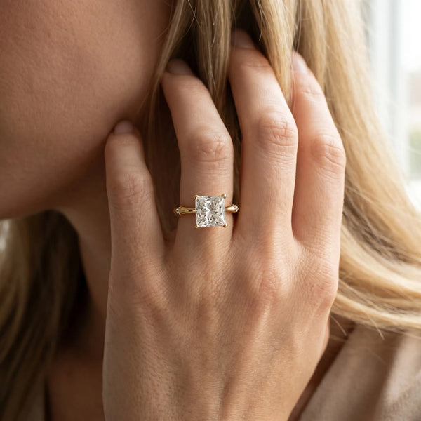 Yellow gold Princess Solitaire Diamond Ring with Bamboo Band and Four-Prong Setting