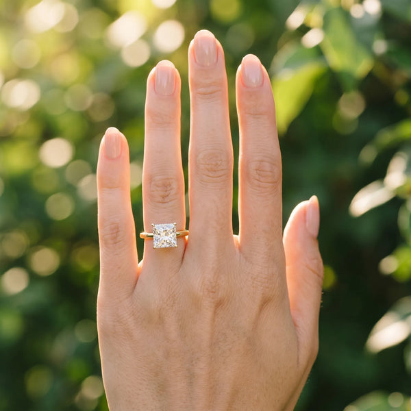 Yellow gold Princess Solitaire Engagement Ring with Cathedral Band and Four-Prong Setting