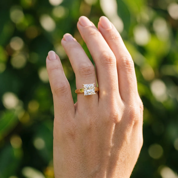 Yellow gold Princess Solitaire Engagement Ring with Four-Prong Setting and Tapered Band