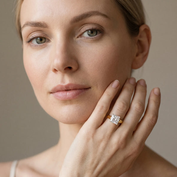 Yellow gold Princess Solitaire Engagement Ring with Four-Prong Setting and Tapered Band