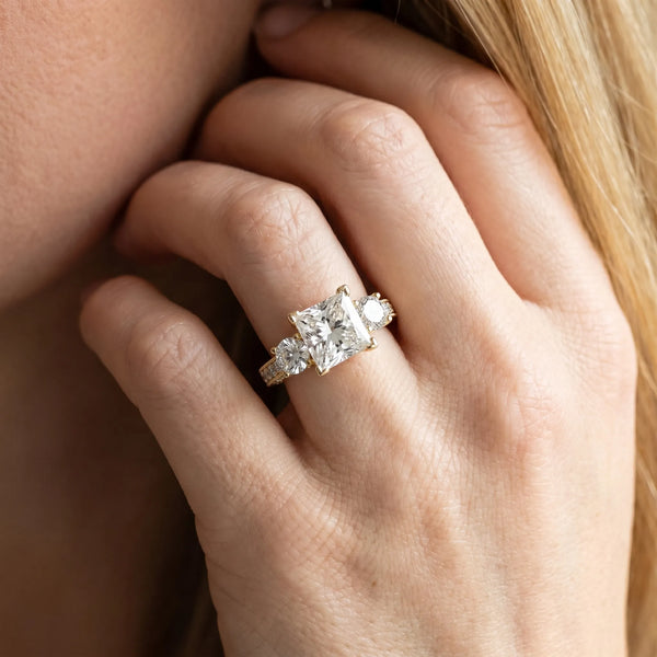 Yellow gold Princess Three-Stone Diamond Ring with Pavé Band and Four-Prong Setting