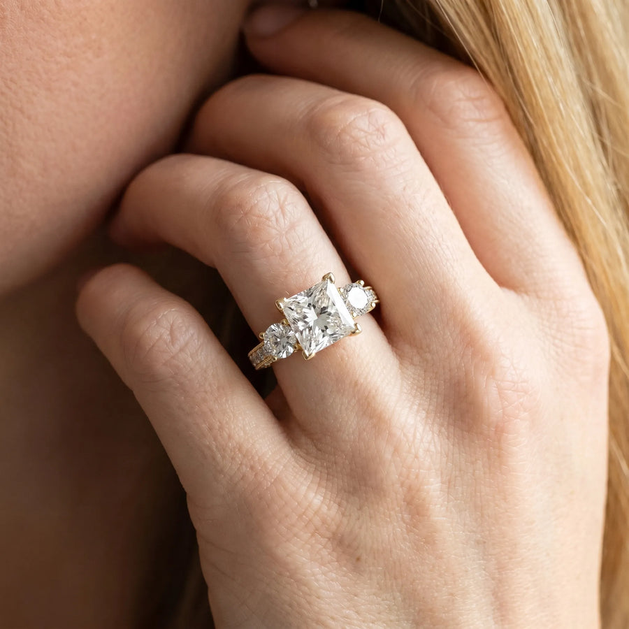 Yellow gold Princess Three-Stone Diamond Ring with Pavé Band and Four-Prong Setting
