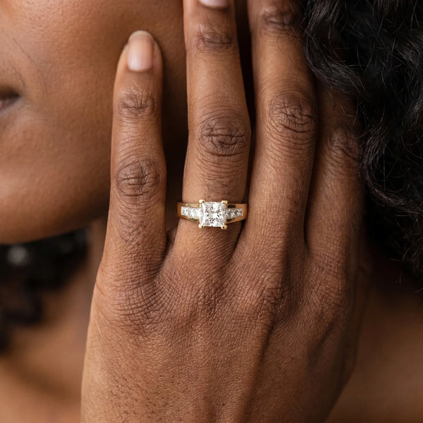 Yellow gold Radiant Cut Channel Set Solitaire Ring with Four-Prong Setting